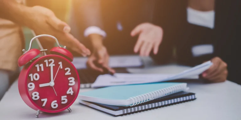 clock with corporate setup in background