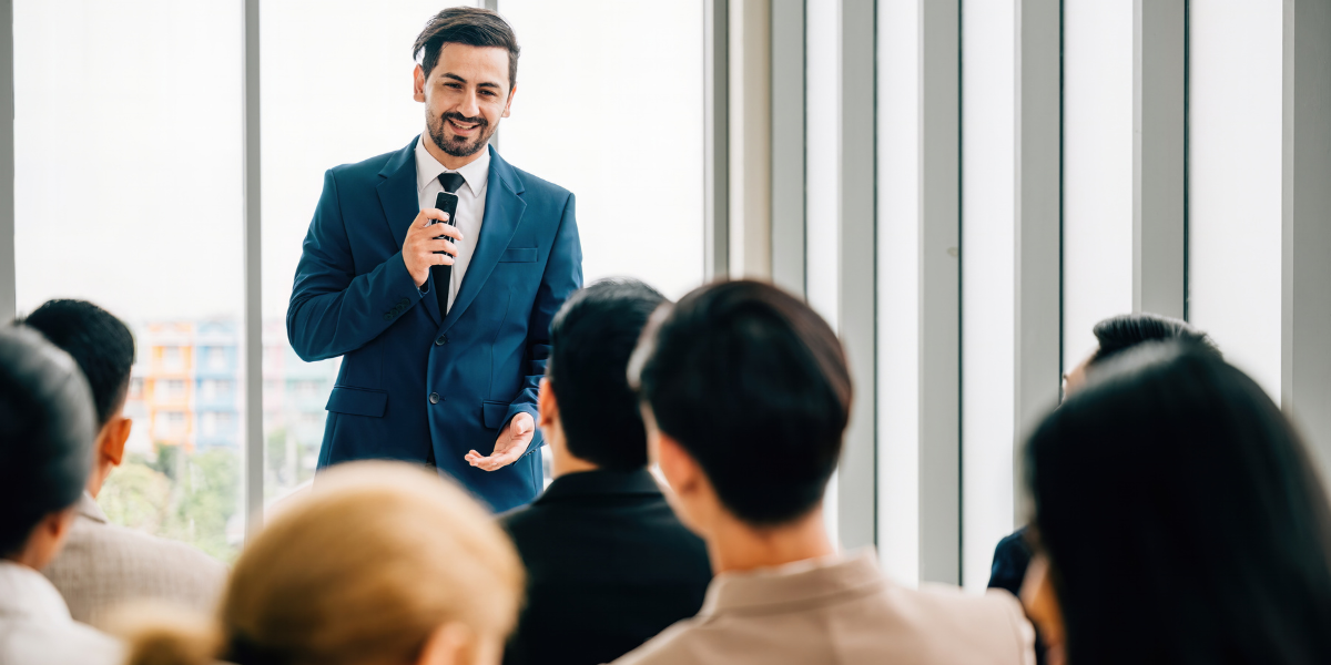 man public speaking confidently